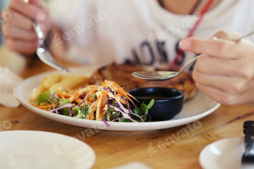 Preview: People heaving enjoy steak dish closeup blur background