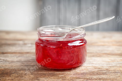 Preview: Jar with sweet jam on wooden table