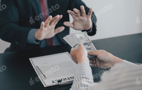 Preview: Businessman hand give bribe to the government officials who refusing money,