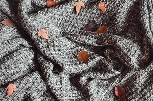 Preview: Grey Knit Blanket with Scattered Fall Leaves