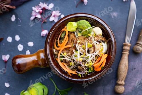 Preview: Top view of a vegan meal with mushrooms, onions, carrots and leek