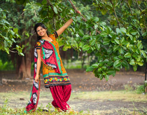 Preview: Beautiful girl between nature full of branches of tree.