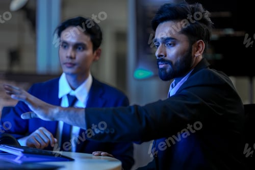 Preview: diverse team of AI developers collaborates on a night coding session.