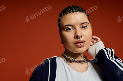 Preview: Stylish young woman with an edgy look posing confidently against a vibrant backdrop