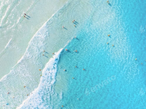 Preview: Aerial view on beach and people. Vacation and adventure. Top view from drone at beach and azure sea.