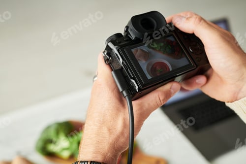 Preview: Man Capturing Overhead Vegetable Still Life with Camera