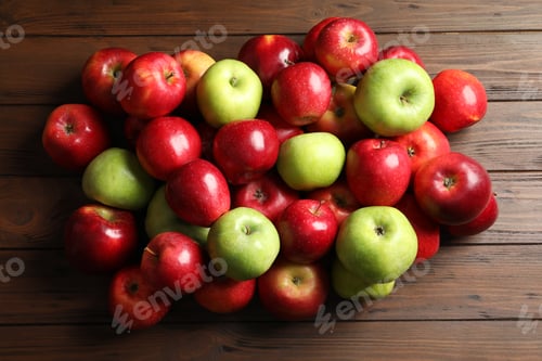 Preview: Fresh red and green apples on wooden background, top view