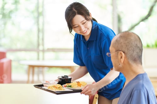 Preview: A caregiver serving the elderly at a care facility