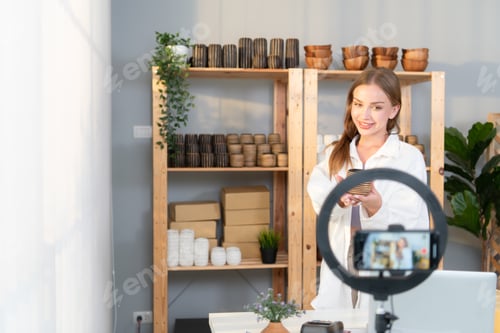Preview: Young female runs a small business making clay jewelry.