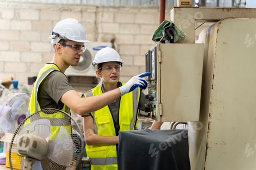 Preview: team engineers meeting computer-controlled steel welding robot