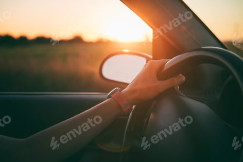 Preview: Female hands on steering wheel