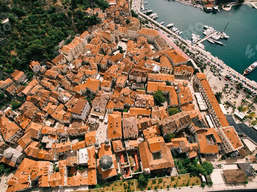 Preview: Ancient houses with red roofs on the narrow streets of the town of Kotor. Montenegro. Drone