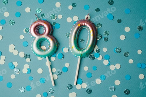 Preview: Celebration with sparkling 80th birthday candles on vibrant blue background