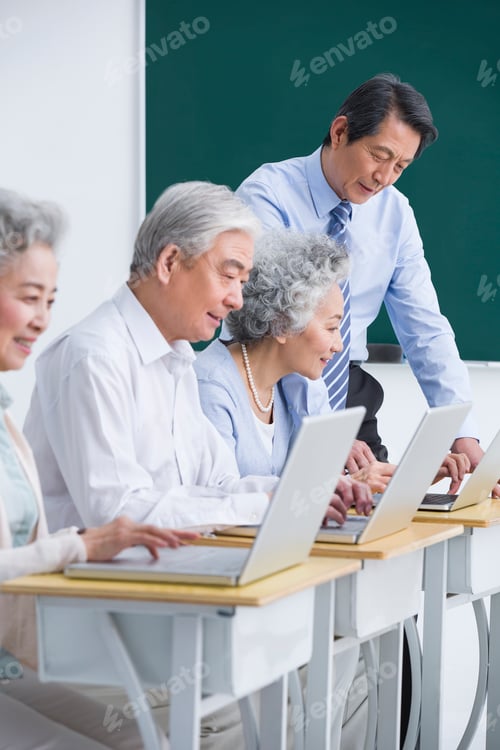 Preview: Senior adults having computer class at school
