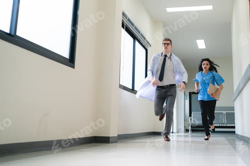Preview: Young male and female professional doctor and surgeon holding clipboard with stethoscope