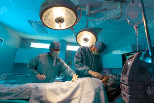 Preview: Surgeons Performing Operation in Hospital Operating Room