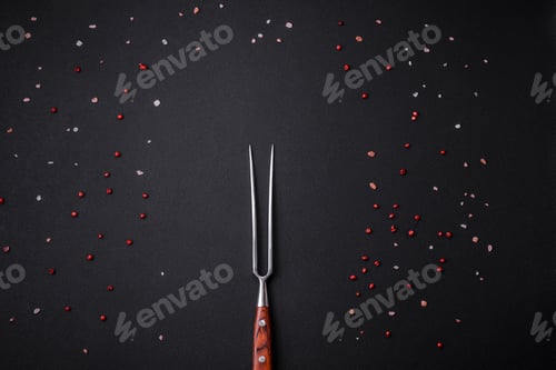 Preview: Black concrete table with spice pink peppercorns and Himalayan salt