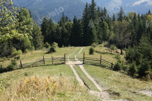 Preview: Beautiful view of mountain countryside with wooden fence