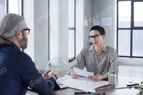 Preview: Business people discussing project