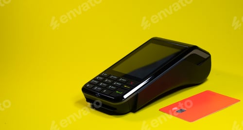 Preview: Bank terminal together with a bank card on a yellow background with space
