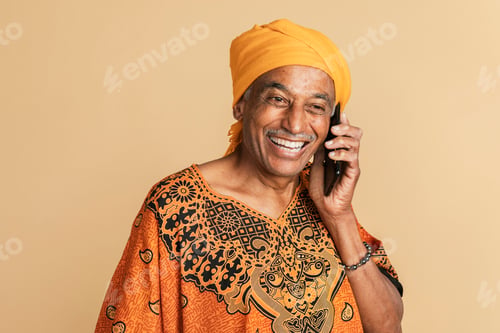 Preview: Senior mixed Indian man talking on the phone