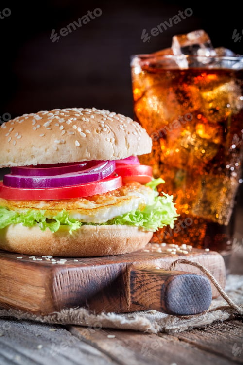 Preview: Closeup of tasty burger with cold drink