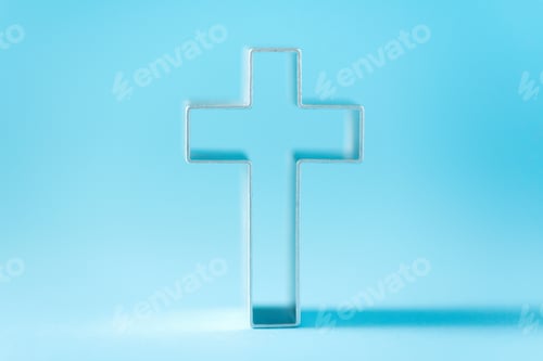 Preview: Christian cross on blue background with soft bokeh lights background. Copy space. Banner. Church