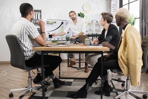 Preview: Businessmen partners sitting at desk. Business conference concept.