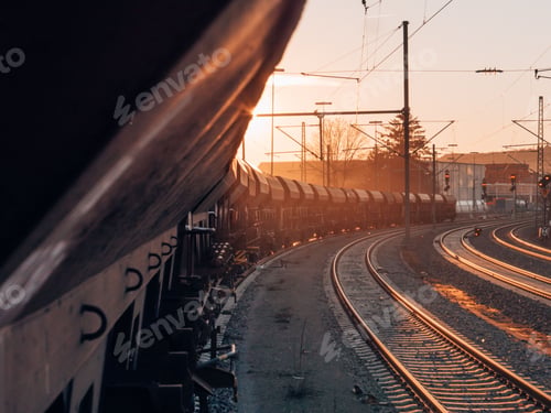 Preview: Cargo train on railways at sunset