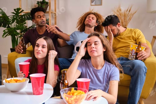 Preview: Group of devastated sports fans watching their football team losing on TV.
