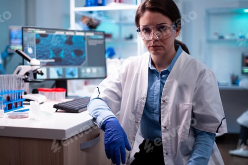 Preview: Chemist scientist specialist in laborator with protective gear