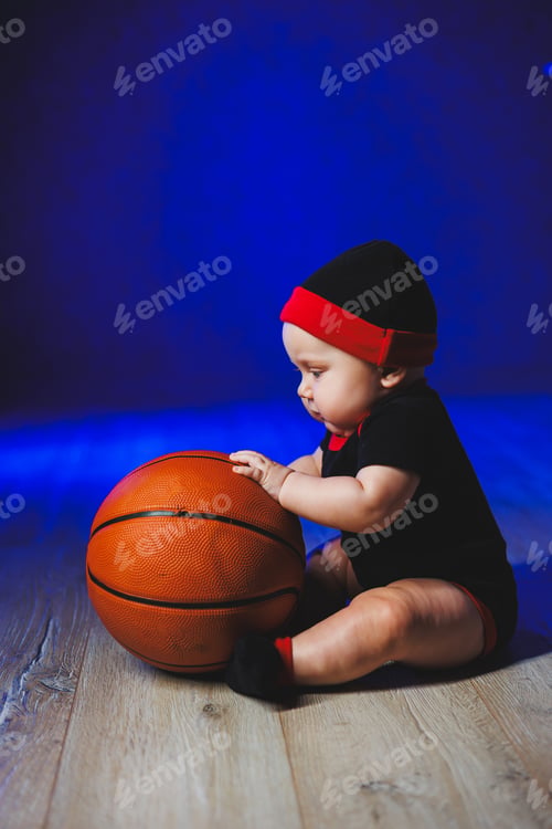 Preview: Baby 7 months with a basketball. Sports for kids. Cotton clothes for babies