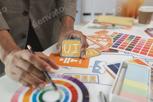 Preview: UI UX designers team working on new website wireframe in office