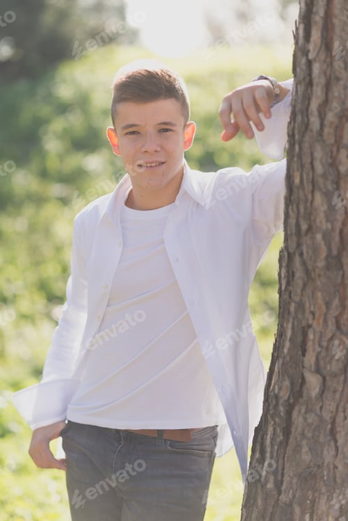 Preview: Portrait of Handsome teenage boy outdoors