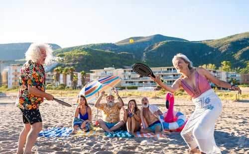 Preview: Happy group of senior friends bonding at the beach during summertime