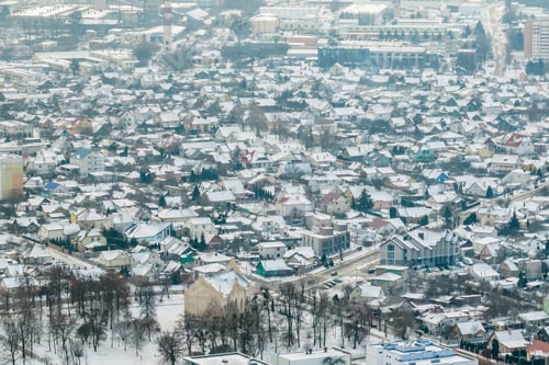 Preview: aerial panoramic winter view of village with houses, barns and gravel road with snow