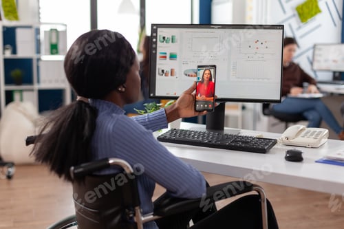 Preview: African american disabled businesswoman discussing with remote manager