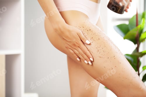 Preview: Closeup woman legs with coffee massage scrub