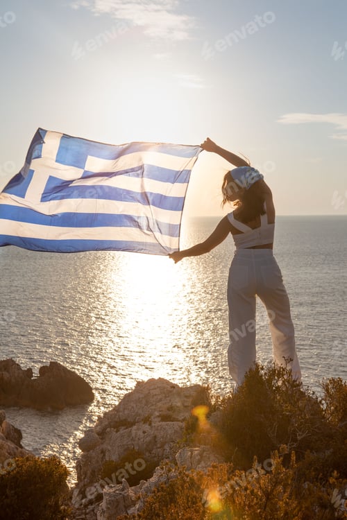 Preview: Woman Holding Flag Overlooking Ocean at Sunset
