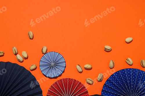 Preview: Pistachios with umbrellas on a light background