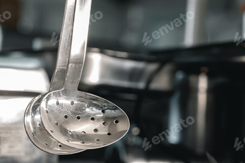 Preview: New metal kitchenware in a row close up
