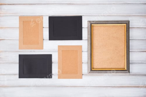 Preview: picture frames of different colors and wooden background