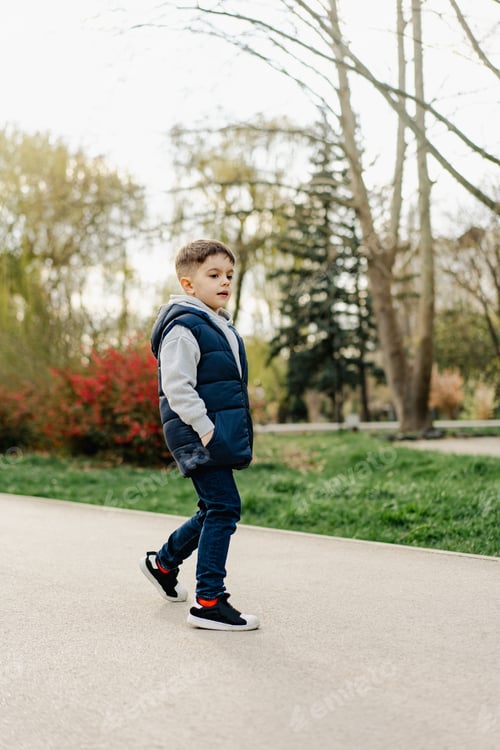 Preview: Funny smiling boy in the street portrait