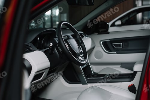 Preview: selective focus of black steering wheel in automobile