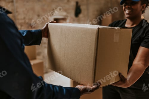 Preview: Delivery man handing box to customer