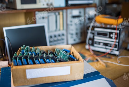Preview: Close-up electric green embedded microcircuits in production