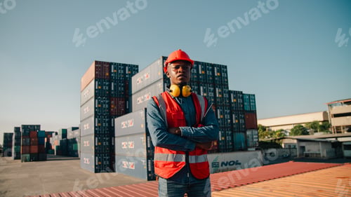 Preview: Industrial worker cargo container logistics safety vest hard hat confident industrial worker