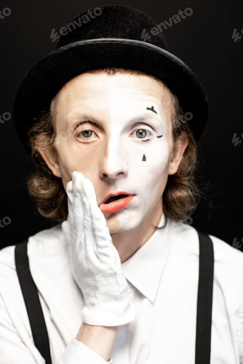 Preview: Mime Artist with Dramatic Makeup Against Dark Background