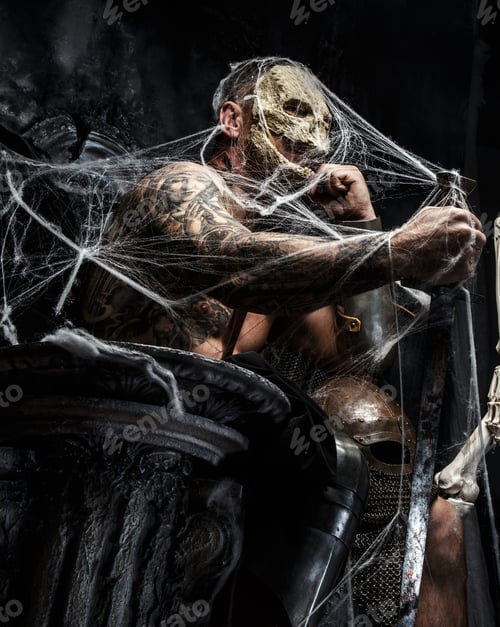 Preview: Muscular man with skull on his face.