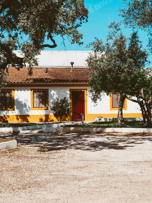 Preview: Traditional stone portuguese house with tree planted yard